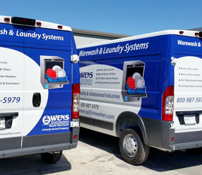 Two of Owens Distributors Vehicles at Warehouse in Central Florida